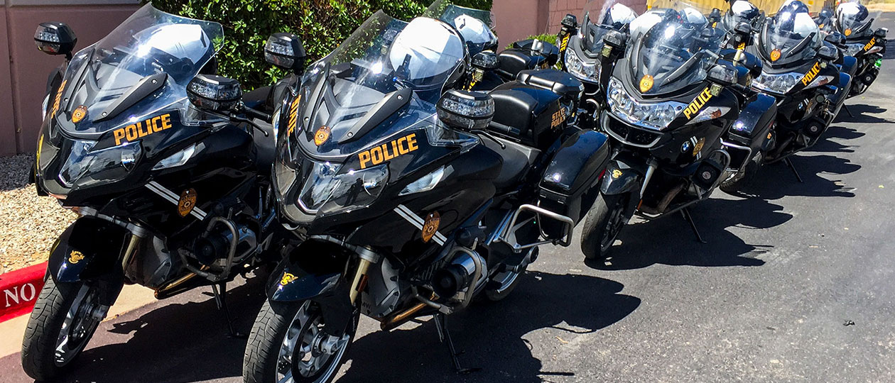 Motor Image 1 A line of black motorcycles marked State Police parked next to curb