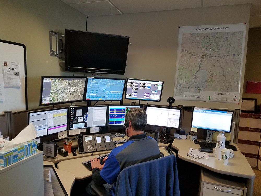 dispatch image 2 Back of man sitting at a desk covered with monitors